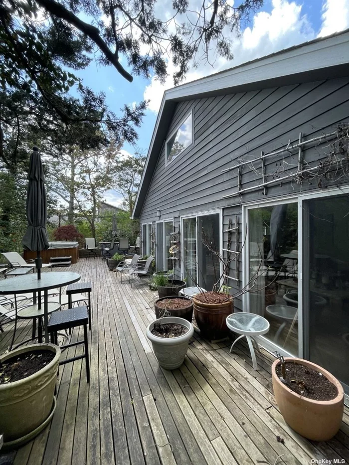 Lovely Contemporary Beach Home on Fabulous Block with 4 Bedrooms, 3 Full Baths. Terrific Deck with Hot Tub and Beautiful Gardens! Home Includes Outdoor Shower, 8 Beach Chairs, Beach Umbrella and a Wagon.