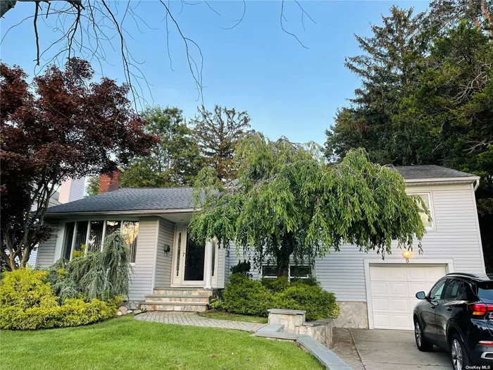 Beautifully Updated Split 3-Bedrooms 2.5-Bath with Expanded Modern Kitchen with Skylights and Radiant Heat. Programmed Underground Sprinkler System, 2100 Sq. Ft. Luxury Living Space. Central AC, Updated Appliances, Wall Of Closets, Perfectly Located on Lovely Street. Syosset School.