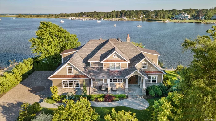A Premier Waterfront Residence with Breathtaking, Panoramic Views of the Connetquot River! Boasts Newer Bulkheading, Dock, Lift and Jet Ski Platform. Affords a Unique Opportunity including 2 Separate Waterfront Lots for a Spacious .52 Acres. Exceeding Expectations when Entering This Exquisite Custom Architectural Designed Residence Completed in 2020 With Spacious Flowing Floor Plan and Stunning Millwork. Magnificent Grand Foyer with Sweeping Staircase, Fabulous Gourmet Designer Kitchen With Norwegian Stone Countertop & Marble Island w/Built in Chargers, Sink & Wine Cooler, Geothermal 3 Zone Heating & AC, Mahogany Flooring, 1st Floor Radiant Heated Floors, Ensuite Master Bedroom With Slider to Patio, 3 Floor Elevator w/Dual Doors, Living Room w/ Stone FPL, Cozy 2nd Floor Family Rm w/Coffered Ceilings, 2 Walk in Attics, 3 Car Heated/AC Garage, Offering A Taste of What This Luxurious Home Has to Offer. Must See to Believe!