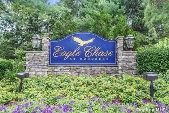 Welcome to this Augusta model condominium townhouse in the sought after Eagle Chase community. The double door entry leads to an updated open floor plan featuring soaring ceilings, gas fireplace, and sliding doors to a private patio area. An updated kitchen features granite counters and stainless appliances. This Augusta model has an additional large great room on the main level. An office space adjacent to the great room features a Murphy Bed and pocket doors for privacy creating a third bedroom option. The primary bedroom ensuite has plenty of closets, a dressing area leading to a spacious primary bath with separate tub. Amenities include stunning newly renovated clubhouse, pool, fitness centers, 2 tennis courts, basketball and pickleball courts. All this awaits you with a 24/7 gated security in Syosset School District. An extra bonus - a 4 car garage.