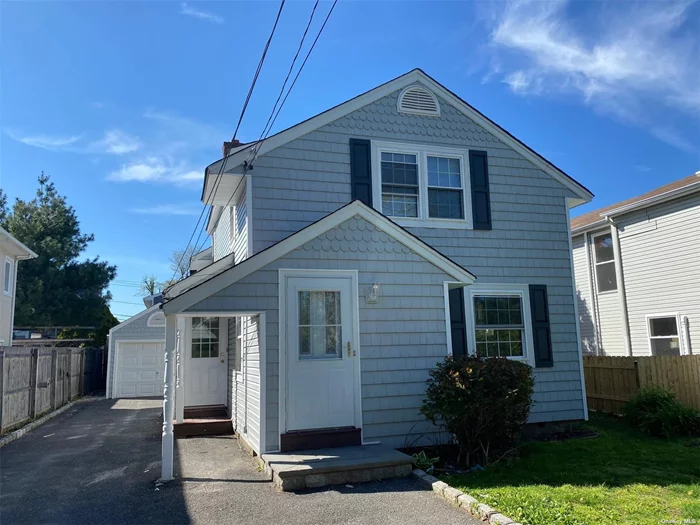 Newly Updated & Gorgeous 1st Floor Apartment! Come See This Incredible Bright 2 Bedroom, 1 Bathroom Apartment with Updated Kitchen and Bath in Manhasset Isle. Close to Stores, Buses, & Parks. Comes with one Parking Spot in Driveway. Tenant Pays Electric. Unit to be delivered with a dishwasher.