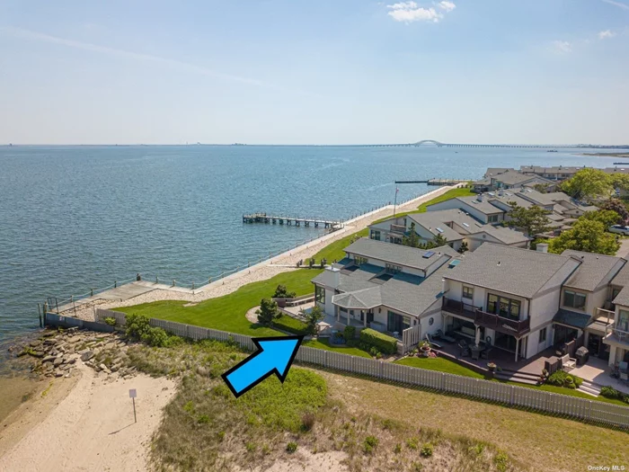 This BAYFRONT END UNIT townhome is one of the largest in community w/approx 3836 sq ft & offers unobstructed bay & bridge views. sunken living room, wet bar & large dining area. White EIK w/breakfast nook. Huge first floor mstr bdrm suite w/WIC & mstr bath, Central Air,  Sliders doors to wrap around deck (liv room & mstr bdrm) w/amazing bay & bridge views. One of the largest driveways & garages in the community. Eastern sunrises and Western sunsets abound!