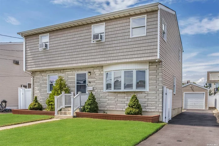 Going, Going, Gone! Renovated approx. 2016! Mid-block, 4 bdrm 2 bath colonial. Enjoy the summer at the Nautical Mile! Granite/Stainless EIK, FDR, 1st floor laundry! Living rm w/woodburning fireplace, beautiful laminate flooring throughout,  Smart LED hi-hats on the first floor and 2 zone nest, 1st floor primary bedroom w/sitting room or den w/sliders to the yard, Detached Custom 1 1/2 car garage w/PVC fence. Driveway redone 2021. PVC fence - 2020, Feb 2022 HW heater, 2017 New Boiler. 150 amp electric. Lots of storage! Seller has elevation certificate, approx. $600 flood insurance. Convenient to the LIRR, park, restaurants and more! Won&rsquo;t Last!!