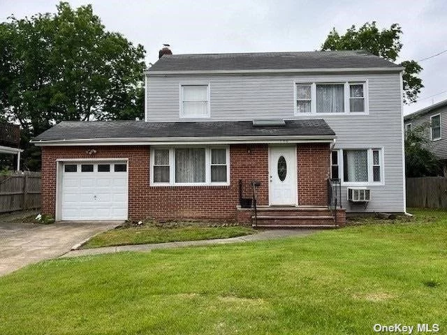 Move right into this 4 bedroom colonial in the heart of Woodmere, with spacious rooms, hardwood floors, a finished basement, and a spacious yard. Close to railroad, shopping & houses of worship.