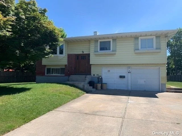 Lovely Hip roof Hi-Ranch with over 1/2 Acre of parklike, fenced property (100x248). Hardwood Floors. Updates: Gas Heat (Rheem burner) approx 5 yrs old, Andersen windows approx 5 yrs old, Roof approx 10 yrs old, Cesspool approx 2 yrs old, (located in front of house between tree and driveway). Room for extended family. Garage, In Ground Sprinklers, Alarm, Air-Conditioning units. Great home, this family owned for 2 generations.