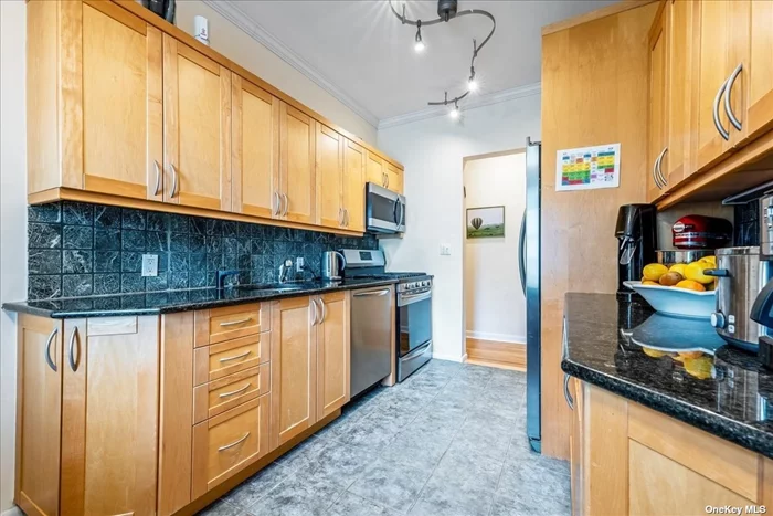 **Motivated Seller ** One of the largest 1 bedroom units on the market. This unit is move-in ready. Washer/dryer hook-up in unit allowed and dedicated indoor parking spot. Located in a quiet residential area away from the highway, but only 6 minutes walk to LIRR, bus, downtown, and shopping. Great view overlooking the gorgeous neighborhood and front lawn. This bright unit has charming character with 10-foot ceilings, original pre-war detail, redone hardwood floors, an eat-in kitchen, renovated bathroom, new electrical boxe, and new stainless steel appliances. Plenty of closets and extra storage in the basement. Huge front lawn, BBQ, and patio outside. Under 30 minute commute to NYC. Access to beautiful Great Neck Park District amenities.