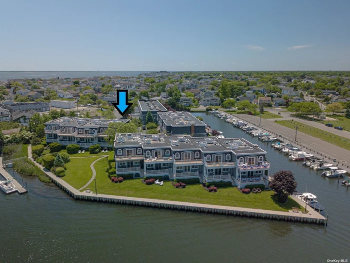 This BAYVIEW END UNIT townhome is one of the largest in community w/approx 2, 737 sq ft & offers unobstructed bay views from 2 composite decks (upper & lower). Unit also has the ELEVATOR w/access to all 3 floors of the home (garage, 1st & 2nd flrs). Enjoy a short trip to Fire Island from your DEEDED boat berth. NO flood insurance required in X zone with 8&rsquo; elevation. This DESIGNER decorated home has 12&rsquo; ceilings in lv rm, kit & dining area. Brand NEW kit w/NEW stainless app&rsquo;s , Miele Espresso/Cappucino, leathered granit counters, oak flrs throughout, 3 large bdrms all en-suite w/own baths. Huge mstr bdrm suite w/WIC & mstr bath, 8-zone radiant heat (inc garage), 2-zone (1st & 2nd Flr) CAC, central vac, alarm, gas utilities, 2 gas FP&rsquo;s (in MBR & LR), 200 amp electric, . French doors to 2 composite decks (liv room & mstr bdrm) w/amazing bay & bridge views. Approx 800 sq ft (64 height) of add&rsquo;l cement flr finished storage area. DINING ROOM CHANDELIER EXCL FROM SALE