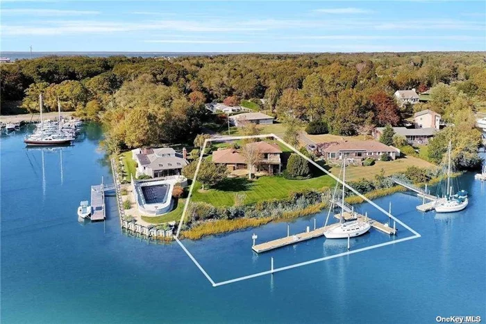 The ultimate getaway and an avid boaters delight! 150 Feet of water frontage with expansive oversized dock suitable for large boats. Open floor plan design is spectacular for entertainers including living room with fireplace and sliders out to deck overlooking Sterling Harbor. Upper level bedroom suite with balcony and panoramic views. Use as a master bedroom ensuite or separate guest quarters. Just minutes to wineries, local area beaches and downtown Greenport shopping & restaurants. A phenomenal spot from which to watch summer fireworks displays! Come see this magical spot for yourself!