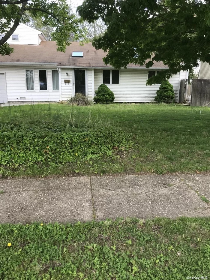 Expanded Split level on quiet street with curbs & sidewalks. 80x185 property. This is a bank owned property, Needs work!