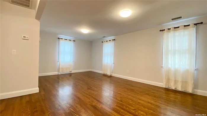 Charming 2nd FL apartment in Oyster Bay. Private entrance on front porch. Enter to spacious foyer. Take stairs to open living room, cozy kitchen, full bath, washer/dryer and bedroom #1. Another staircase leads to top level that could be lived in as bedroom, office or bonus space. Hardwood floors throughout. Central air. Comfortable space, convenient location.