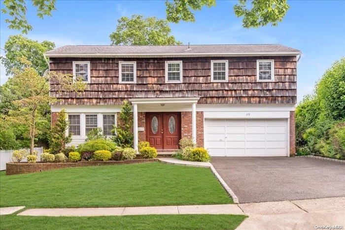 Welcome Home to this Expansive Center Hall colonial in the heart of Searingtown within the Herricks School District!  Upon entering you immediately feel the open and airy floor plan with generous sized windows which allow plenty of natural light in. 4 spacious bedrooms and 2 1/2 bathrooms grace this well maintained home.  Large eat-in kitchen and grand family room with wood burning fire place.  Enclosed sunroom with sliding doors to the backyard make for additional entertaining space. Set on a lush landscaped mid block location. Easy access to major highways, shopping, restaurants, and houses of worship.