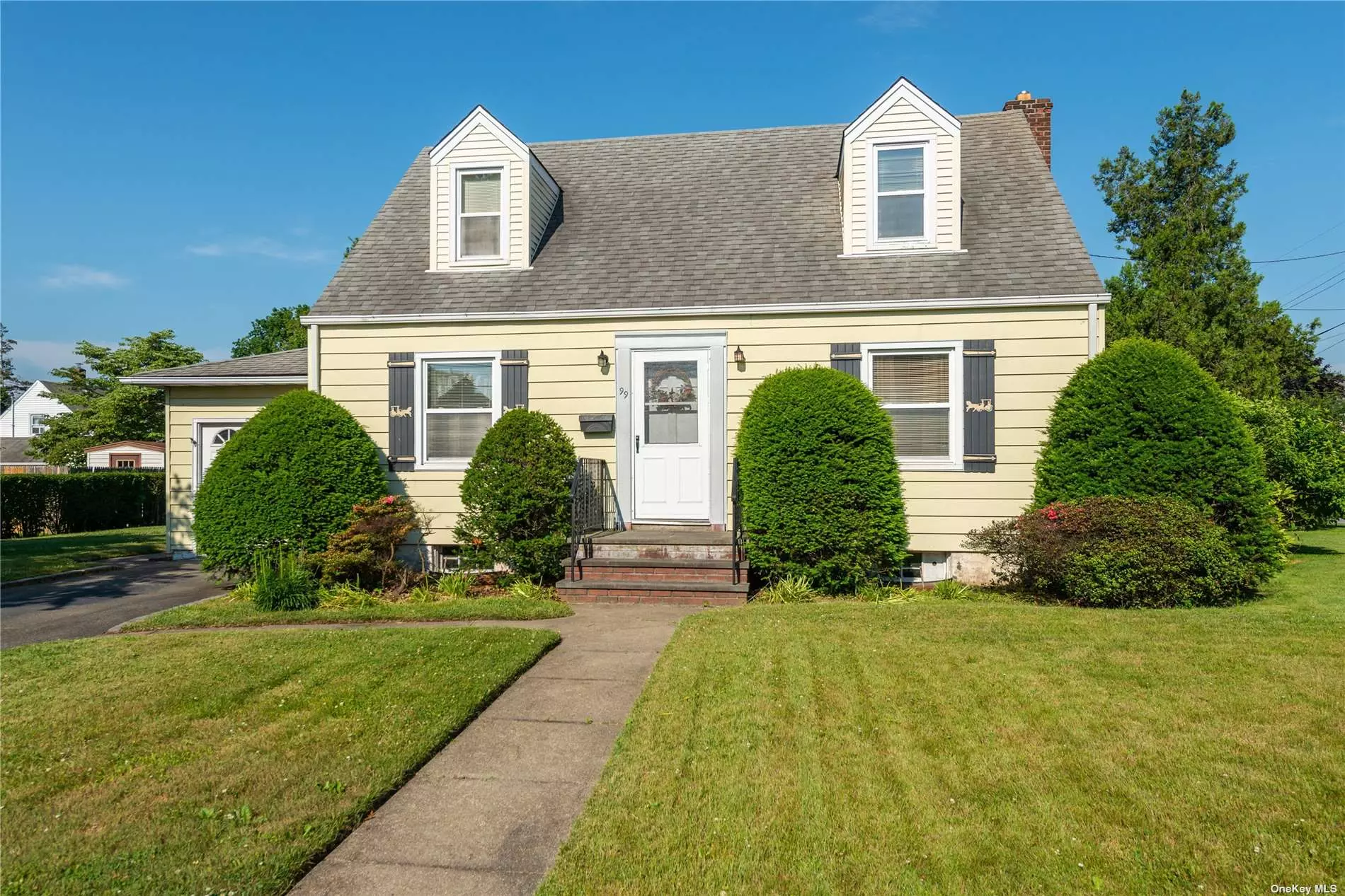 Spacious & Bright throughout! A wide-line cape-style home with 2 full baths a full basement, living room, eat-in-kitchen, 4 bedrooms, hardwood floors, updated kitchen and baths. Lovely property 100 x 100. Gas is in the house already. Low taxes- a must see!!!!