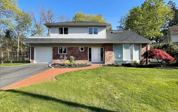 Fabulous MOVE IN READY HOME in the village of East Hills! Gut renovated w/functional & modern updates. This 4 Br, 2.5 Bth split level sits at the end of a quiet street & offers a formal LR w/wood burning fpl, Great Rm, an open concept, custom designed kitchen with brand new Thermador appliances, gas rangetop & quartz countertops. Primary BR has an ensuite bthrm & door to balcony. New hrdwd flrs throughout, updated bathrooms w/custom vanities. Skylights & large windows flood the home with natural light. Vaulted ceilings. Brand new roof, skylights, doors. Central HVAC conversion from baseboard, oil to gas conversion. Refinished basement w/new washer/dryer. LR opens to a large private patio & kitchen opens to a large deck with steps down to the patio; the house is perfect for hosting! House sits on an oversized lot with a Gunite pool & lg pvt deck/yard. Lots of privacy. Access to amazing East Hills Park/Pool/Tennis/Gym/Walking Trail/Theatre. Close to All, LIRR, shopping & restaurants.