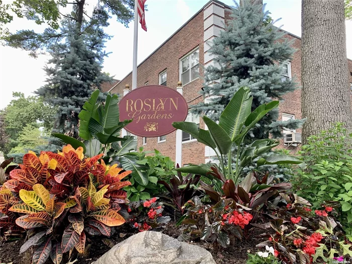 Welcome to the Peaceful & Private Roslyn Gardens Community with this Two Bedroom, Ground Floor, Corner Apartment. Well Maintained with Plenty of Closet Space. Hardwood Floors thru-out Entry Foyer w/Deep Closet, Spacious Dining Area & Living Room. Each Bedroom has Two Closets, Including the Primary with a Walk-In. Unit is Nestled in a Beautifully Landscaped Park Like Courtyard. Large, Clean Laundry Facility On Site. Maintenance Fee Includes Heat, Water, Sewer, Landscaping, Snow Removal, Taxes, Garbage Removal, and Cooperative Insurance. Ideal Location to Railroad, Bus Stop, and Highways. Great Location to the Desirable Roslyn School District Schools. The Exact Location to Home. Do Not Hesitate. (Minimum Down Payment is 20% and No Flip Tax.)