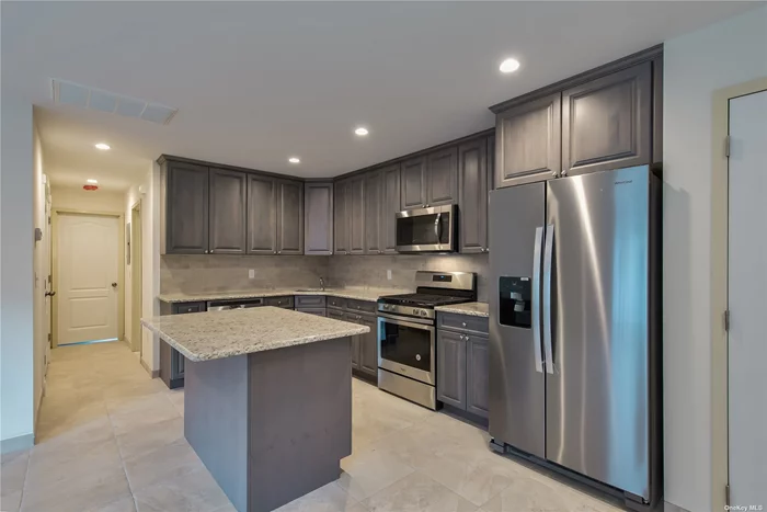 This is a spacious and sunlit unit that offers laundry in the unit and a private garage. The open floorplan with doors to a deck make this a wonderful place to live.