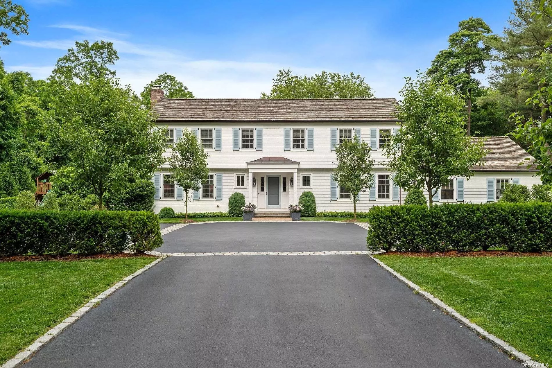 A courtyard welcomes you to an exceptionally renovated in 2017 custom built Colonial in the Village of Lattingtown. 4 Bedrooms and 4.5 Bathrooms set on 2 flat acres with mature plantings and incredible brand new gunite salt water pool . Chef&rsquo;s Eat In Kitchen with top of the line appliances and marble countertops opens to gracious Family Room with custom built-ins. Charming Living room with wood burning fireplace, powder room, elegant dining room and inviting sunroom with second Wood burning fireplace. French doors open to blue stone terrace with outdoor kitchen which is an entertainer&rsquo;s dream. Sophisticated Primary Suite with oversize walk in closet and ensuite bathroom. Three additional spacious bedrooms and 2 full baths complete the Second floor. All bathrooms have radiant heat and custom vanities. Finished Basement with playroom and gym. Gas heating, whole house water filtration system and generator. Close To Town, Parks, Train Station & schools.