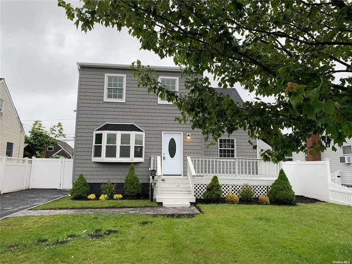 beautifully all redone dormered cape featuring new white shaker kitchen granite countertops ss appliances 2 new full baths hardwood floors throughout hi hats new front shake siding new windows new gas boiler an hot water heater full finished basement with outside entrancenew driveway mint move right in