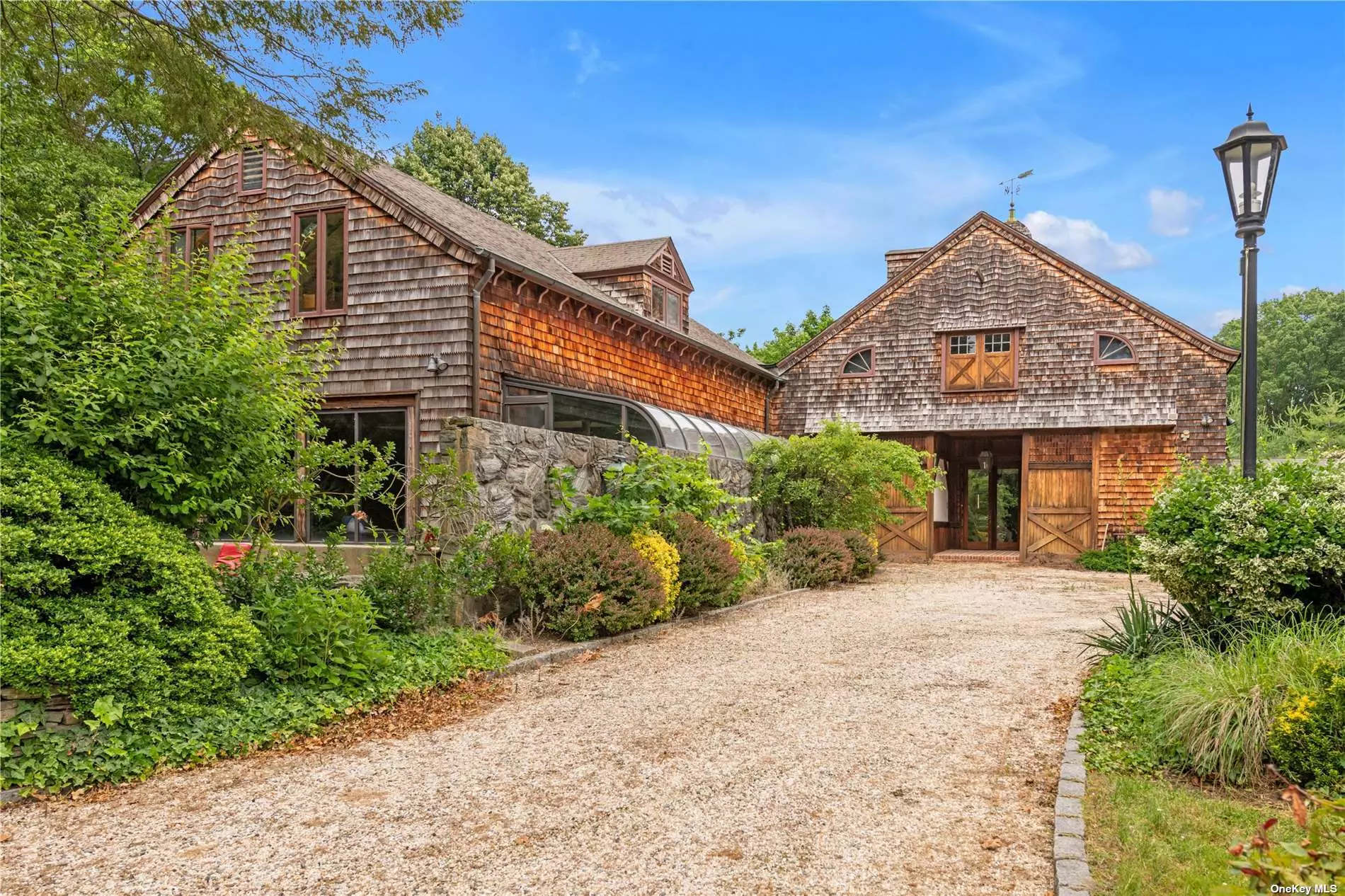 Once in a lifetime chance to own a piece of Sands Point history. Privately set in the heart of Harbor Acres this 6615 sf. colonial was once the stables for the Vincent Astor Estate. Built c. 1851 and expanded and renovated in 1972 this unique converted barn transports you to a bygone era while offering today&rsquo;s amenities. Magnificent two acre parcel features decks, patios, specimen plantings PLUS accessory three bedroom cottage. Indoor pool, beach and tennis rights. House is being sold as is Your chance to restore or build your dream.