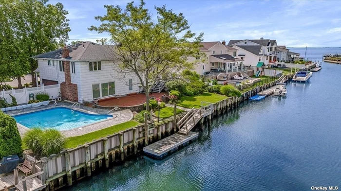 Fantastic Waterfront Colonial Split 2nds to the Open Bay, Nestled in the Prestigious Bar Harbour Community. This Meticulously Maintained Home Features: Spacious Living Room with Vaulted Ceiling, Banquet Dining Room, Custom Designer Eat-In Kitchen with Picture Perfect Bay Views, Granite Countertops, High-End S/S Appliances, HW Floors. Fabulous Family Room with a Gas Fireplace and Sliding Pella Doors to your Entertainers Backyard, 1st Floor Office or Bedroom, Laundry/Mud Room and Powder Room. Master En-Suite with His and Hers Closets and Three Additional Bedrooms with Large Family Bath. Enjoy your IG Swimming Pool and Enjoy Spectacular Views of the Bay. 100&rsquo; of Bulkhead with a ramp and floating dock for all your Water Sports and Boat. Newer Plastic Sheeting Bulkhead and Helical Piles. Professional lush landscaping, 2 car garage, and partial basement, low taxes., X Flood Zone, current flood $790. This is an Amazing Opportunity to own your Waterfront Dream Home and Live the Salt Life!