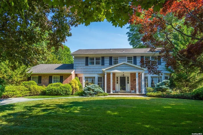 Make this classic center hall Colonial your dream home. Located mid-block on spectacular and pristine landscaped half-acre with an expansive bluestone patio and gorgeous in-ground gunite pool with brick patio, this 4-bedroom 3.5-bath home provides the perfect setting for family fun and grand entertaining. This residence boasts natural gas heat with gas line to grill and fireplace in den (for hook-up). Central Air, Central VAC, eat-in kitchen, formal dining and living rooms, den with fireplace and huge finished basement. Convenient to fine dining and shops, minutes to Americana, low taxes (under $18k!), trash pick-up incl in village tax, expansive driveway with plenty of parking. North Shore Schools (Glenwood Landing Elementary).