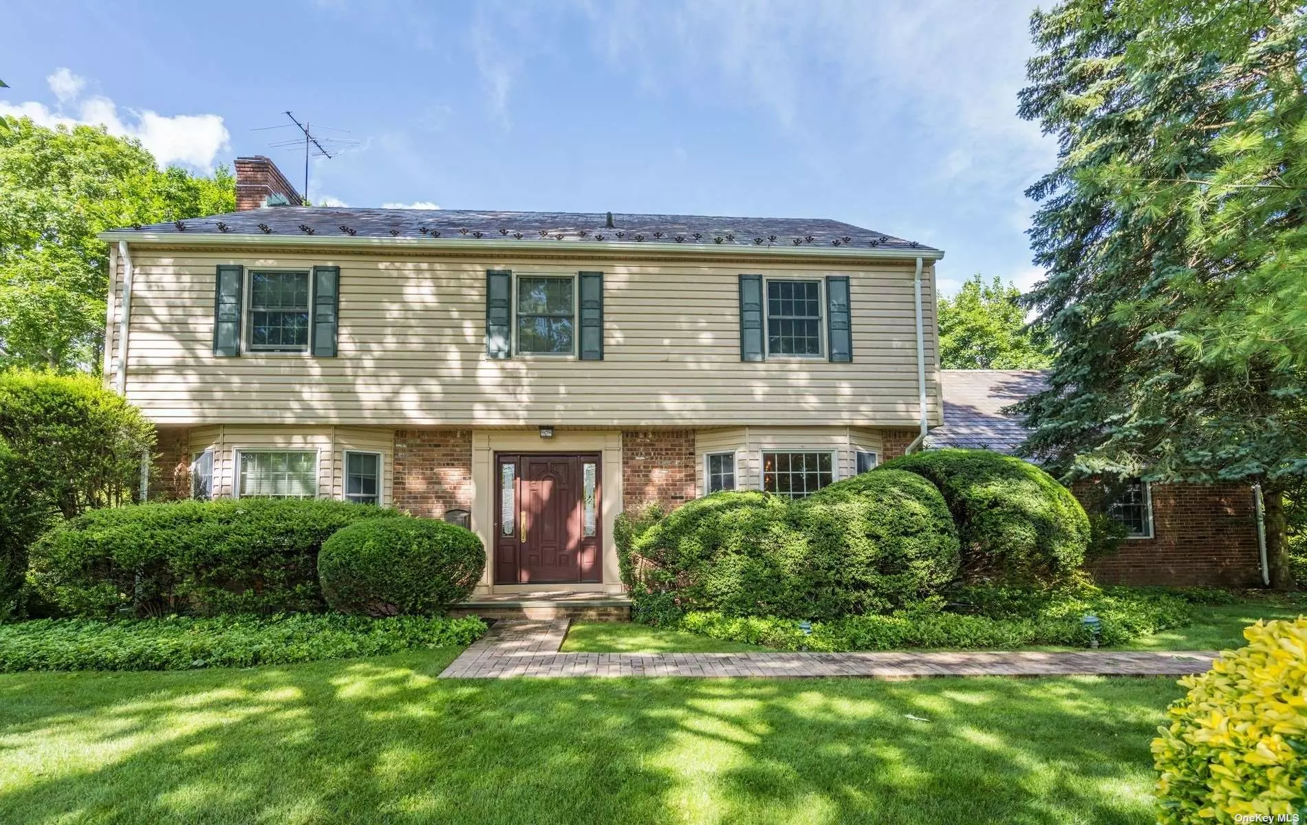 Welcome To This Charming Sun Drenched Center Hall Colonial in the Desirable Canterbury Woods Section of East Hills. This home features a Formal Dining Room, Living Room with Wood Burning Fireplace, Eat In Kitchen, Library and Den with Beautiful Hardwood Floors Throughout. The Second Floor includes a Primary Ensuite and 4 additional Bedroom. An Additional Back Staircase leads to the Guest Suite. Roslyn Schools & Membership to East Hills Pool and Park. Must See!