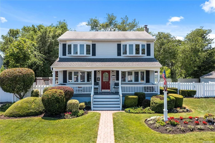 BEAUTIFUL VILLAGE OF LINDENHURST OFFERS A MAGNIFICENT 100X100 LOT SIZE COLONIAL HOME! Gorgeous Colonial! This home is a One Family home with a Two Family permit. First floor has a beautiful entry and maintains a great layout with Southern Exposed Living Room, Spacious Eat-in Kitchen, Two Bedrooms and One Bathroom. There is a backyard porch off from the kitchen and gives you access to the back yard. Second Floor Features an Ultra Spacious Living Room with Cathedral like ceilings, and Open Concept Second Kitchen with an outside Terrace and exit to back yard, plus One Bathroom. The LOT SIZE is Tremendous! A BEAUTIFUL WHITE PVC FENCING throughout. There is an outside deck that is custom designed with additional LED railing. A huge Side Yard with more area for building to your suit. A separate garage with a 4 Car Private Driveway. This home is just one block from LIRR station Lindenhurst stop.