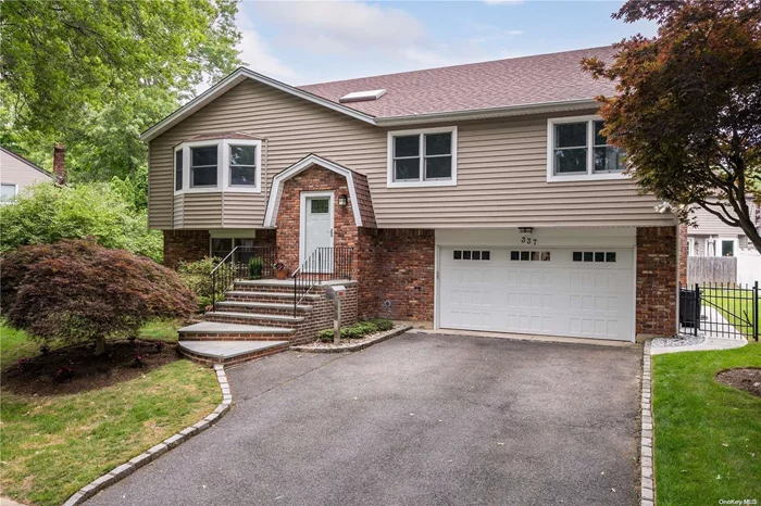 A 2474 square foot, 4-bedroom home in Carle Place School district in Campo Villa. Built in 1978 and recently renovated featuring lower-level gas fireplace, 2 zone heating and new high efficiency boiler and tankless water heater. The open concept floor plan is large and airy with a fully renovated kitchen and custom cabinets, custom closets, stainless steel appliances and a large kitchen island with Quartz countertop. new baths, hardwood floors on the main level, all new central air, a skylight, and new windows throughout, large driveway & large partially fenced-in yard that is oversized, a must see !!!!!