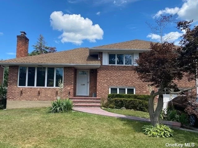 Beautifully Maintained Brick Split Located In Syosset School District. Welcome To This Sun Filled Home With Gleaming Cathedral Ceilings, Skylights, Oversized Windows, Sliding Doors And Gleaming Hardwood Floors. Living Room with Wood-Burning Fireplace, Formal Dining Room with Sliders Deck and Large Bright Kitchen with Skylights Complete the First Floor. Upstairs Is The Primary Bedroom with Ensuite, 2 Additional Bedrooms, & Large Full Bath. Lower Level Den with Sliders To Patio and Fenced Yard, Powder Room, Bedroom and Entry To Oversized Garage. Finished Basement with Laundry, Storage & Utilities and Additional Room. Professional Photos Coming Soon.