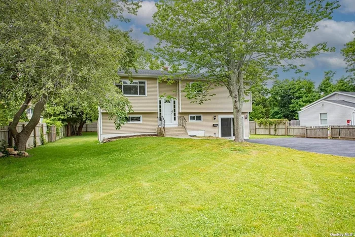 Wideline Hi-Ranch Overlooking the West Sayville County Golf Course. New Kitchen, New Bathroom, New Roof, New Hot Water Heater. Ready to MOVE IN !