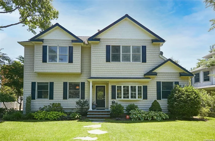 This gorgeous, completely renovated 4 bedroom, 2.5 bath 1906 center hall colonial is a classic. Situated on a large, private, fenced-in property. This sunny, bright and spacious home also has a 2-car garage with artist studio. Seamless flow throughout with immaculate wood flooring, central air, huge living room overlooking the manicured grounds which has room for a pool. Additional formal living room with fireplace. Full master suite and office on 1st floor. Village, beach & low taxes!