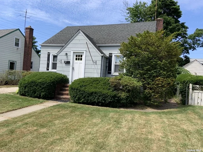 This lovely New England Cape in Farmingdale Village on a quiet residential block is waiting just for you! Hardwood floors. Newer architectural roof. 1.5 detached garage. Close to all! Full Sized Basement With High Ceilings. Come See It Today !