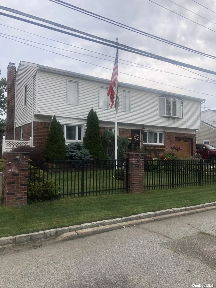 One of a Kind 2850sqft 2 Family by Renewable Permit in Newly Revitalized Village. Near Lirr, Shops & Resturants. Home Loaded W/Amenities. Bright & Cherry Through Out. Leased Solar Panels. Total Annual Cost $1, 700 Includes Lease & Electric Bill. Granite Countertops & Back Splash, 3 Full Baths (1 in Master Br) S.S. Appliances. Cac Upstairs w Electric Air Cleaners, Each Apt has Own Washer, Dryer & Dishwasher. Full 3/4 Fin Basement W Bar & Notty Pine Walls. 3 Zone Gas Heat. Home Was Expanded 25 Yrs Ago. Igs, 11 Close Curcuit Tv Cameras. 70ft Paver Stone Drievway, Garage W/Loft. Architectual Roof 8 Years Young. Too Much To List!