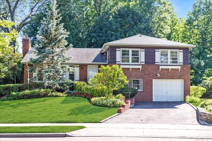 Very special Morewood Oaks Split Level has been masterfully expanded to include a cheerful breakfast room off the open kitchen and adjoining family room, both with stunning walls of glass. Four bedrooms include three on second floor, and one at grade. Family room at grade plus large basement. Light-filled and spacious, this is the definition of easy living.