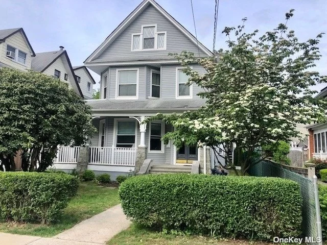 A Rare Legal 2 Family Victorian home. Renovated kitchens and baths. New siding, cement, water main, sewer, updated electric, huge yard with private driveway and 2 car garage. Great space for a large family. Open front porch with trek flooring, new windows, back staircase which connects all floors. Wide one way street.