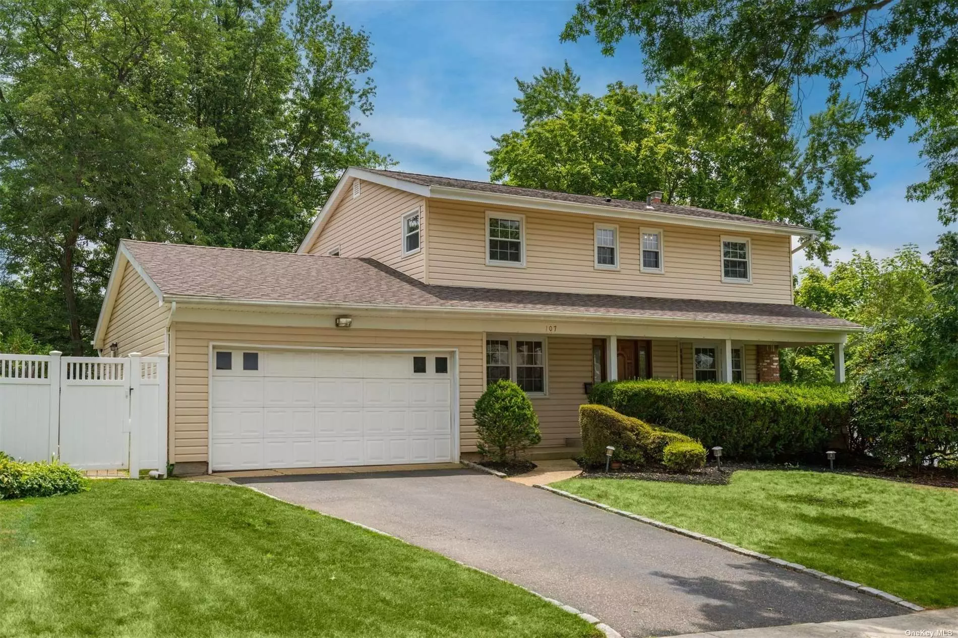 Freshly painted and ready for you! Mid block 4 bedroom, 2.5 bath colonial with sliding doors from den to flat back yard perfect for entertaining! Generous kitchen with seperate breakfast room and large living room, formal dining room, wood floors, and spacious bathroom on the second floor. Master with full bath. Come in and make it your own!