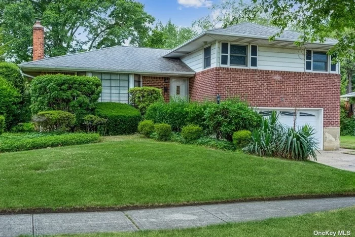 Amazing Opportunity To Own This Large Brick Split In Perfect Mid Block Location On Pretty Tree Lined Street In Woodbury Hills Oversized Parklike Property And Low Low Taxes ( $11, 674 after star) Make This A Must See 3 Generous Bedrooms, 2 1/2 Baths 2 Car Garage, Make This Home A Winning Choice. Keep Your Cool This Summer W Central A/C Add To its appeal. This home Shines With Natural Light And Has Hardwood Floors Throughout. Ready for the next lucky family to make it their own.  Close To Shopping, Transportation, Houses Of Worship