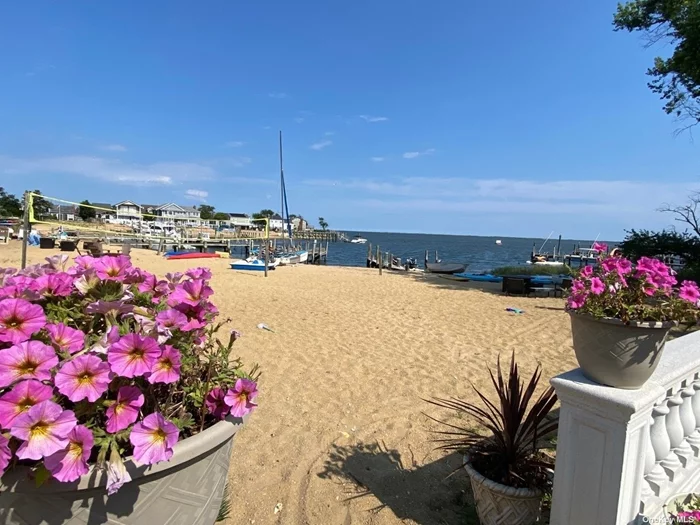 Imagine yourself living in this Beachfront Beauty on a Private Cove in Massapequa. This E X T E N D E D split is located on a quite dead-end street on a 60 x 178 ft lot. With 4 bedrooms and 3 full baths, this house is almost 2500 sq feet of luxury. High ceilings, updated gourmet kitchen, 2 custom fireplaces, skylights, amazing bathrooms, floors and more!  Transferable Solar Panels.. STAR $1265.00 Private Beach.