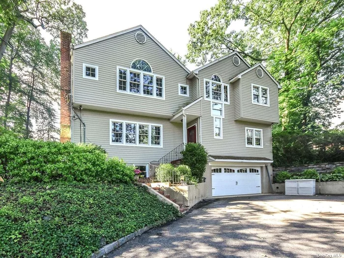 Gorgeous Open Flow Colonial. Greeted By The Soaring Two Story Entry Foyer. Private And Serene With Green All Around Located Across From The North Shore Country Club. Custom Designed Kitchen With Oversized Center Island. Skylights And Windows Bring The Natural Beauty In. Primary Suite With Walk In Closet. Carrera Mable Primary Bath. Total Of Six Bedrooms And Four And A Half Baths. Finished Walk Out Lower Level With Laundry And Mudroom. Two Car Attached Garage. Close To Schools And Shops And All The North Shore Has To Offer!