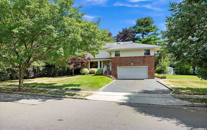 Located in the Bird Section of Woodbury sits this immaculate & updated 4 bedroom, 3.5 bath expanded Split. Hardwood floors throughout. Eat in Kitchen with wood cabinets and granite with sliders to Trex deck. 2 Primary bedrooms suites with full baths plus 2 additional bedrooms and a full bath. Family room with sliders to brick patio. Finished basement. 2 car garage. Freshly painted. Syosset School District.