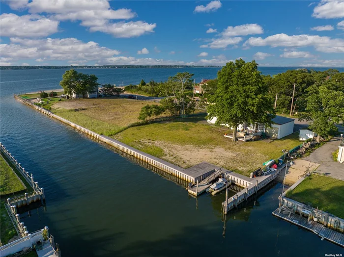 Magnificent Sunsets from this shy half acre direct waterfront with 120&rsquo; of bulkhead and dock on Peconic Bay. Live the life you always wanted on the water, enjoying kayaking, paddle boarding and boating right from your backyard with sandy beach within 250 feet of the front door. Outstanding opportunity to own a large parcel on Peconic Bay with westerly sunset views. House needs TLC.