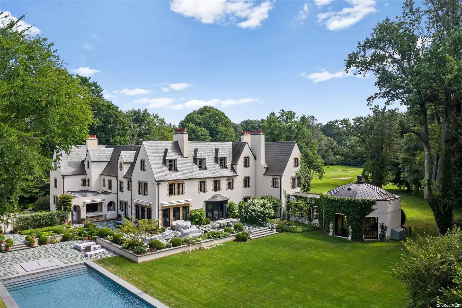 Located in the prestigious Village of Matinecock, this Historic 1926 French Normandy on 6+ Prime Acres originally built for J.D Lyons by Delano and Aldrich. Oliver Cope, Architect, Miles Redd, Interior Designer and Ed Hollander Landscape Architect have Transformed this Manor into a True Masterpiece. Luxurious Living with Intimate Rooms Designed for a Modern Lifestyle. An Exceptional Addition of an Octagonal Room Makes this One of A Kind Home Even More Special. Quality Updates Throughout Meld with Original Details Including Antique Parquet Wood Floors, 12 Fireplaces, Fine Paneling and Mouldings. Tranquil Property offers a Pool, Pool House, Tennis Court, Outdoor Kitchen, Gardens and Terraces. Elevator, Nest System, 3, 000 Bottle Wine Cellar, Art Studio, Finished Lower Level, Updated HVAC, Geothermal Heat, Separate Garage. Simply Exquisite.