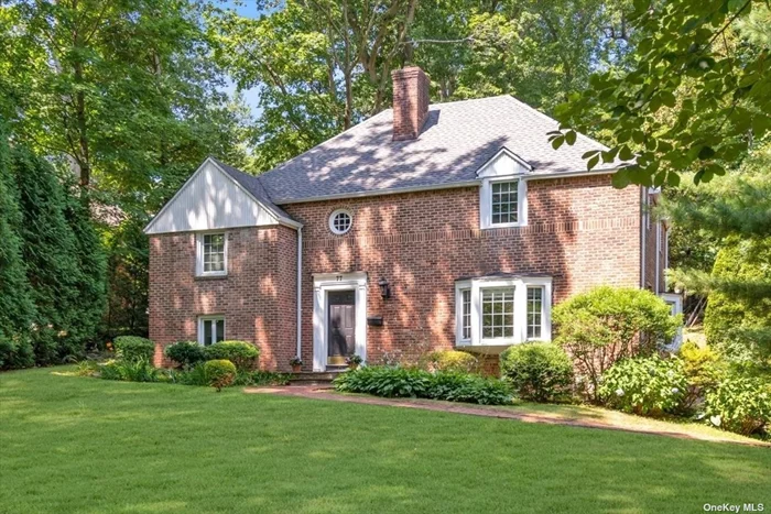 Beacon Hill Beauty! Privately set and approached from Beacon Drive this stately, 4 bedroom brick colonial truly delivers. Sun-drenched principal rooms with gleaming HW floors, state of the art chef&rsquo;s kitchen adjacent to den, a Five-star primary suite with two dressing room closets and designer bath. Magnificent grounds featuring a lovely rear patio with awning. 2 car garage. Beach and Tennis Association rights. See feature sheet for many recent upgrades. Convenient to town and LIRR. Low taxes.