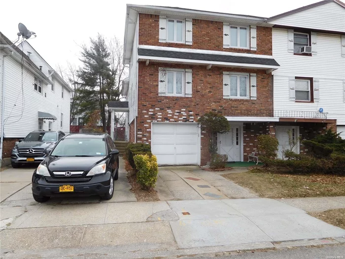 Legal 2 families house located in the heart of Oakland Gardens. The first duplex apartment features an Entry foyer, Spacious living room, Formal Dining room, Eat-in-Kitchen, 4 Bedrooms, and 2.5 Baths with an entrance to garage and back yard; Finished basement with a half bath. Fully renovated second duplex apartment features a Separate entrance, Spacious living room, Formal Dining Room, Eat-in-Kitchen, 3 Bedrooms, and 2 Baths. 2 New furnaces, new air conditioner and hot water boiler. 3 car driveway. Close to LIE 495, Schools, and Shopping. Express bus to Manhattan, Q27 to Flushing Convenient to all. A must-see!,