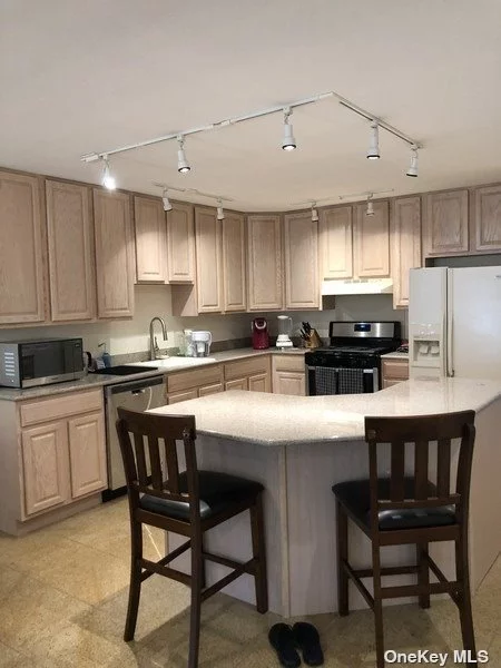 Spacious Duplex featuring living room/dining area,  modern EIK and powder room on the 1st floor. Upstairs offers primary bedroom w/bath, +1 addtl bedroom and full bath. Finished lower level with laundry. CAC, 1-car garage.