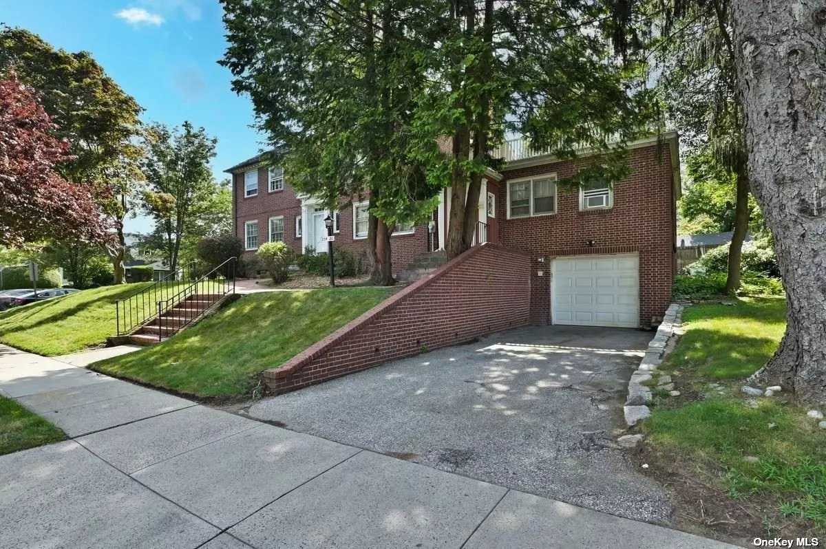 RARE FIND IN GREAT NECK 100 x 100 CH Colonial Two Family. Corner Brick Georgian Colonial circa 1926.  Main house is Living Room, dining room, kitchen, mud room with laundry, 1/2 bath. Second floor four bedrooms two baths with pull down stairs to attic. Large 24 x 24 porch off bedroom. Open basement with access to two car garage. The separate apartment is attached with separate entrance with Living room, dining room, Eat In Kitchen and full bath, 2 bedrooms. This home was converted to a two family and can easily be converted back to a large 6 bedroom home The heating system is 6 months old and the roof is slate. Large corner lot with access to patio from both apartments. The survey is attached and floor plans. One block south of Northern Blvd., access to major highways, LIRR, school, park and shopping. Your imagination awaits you.