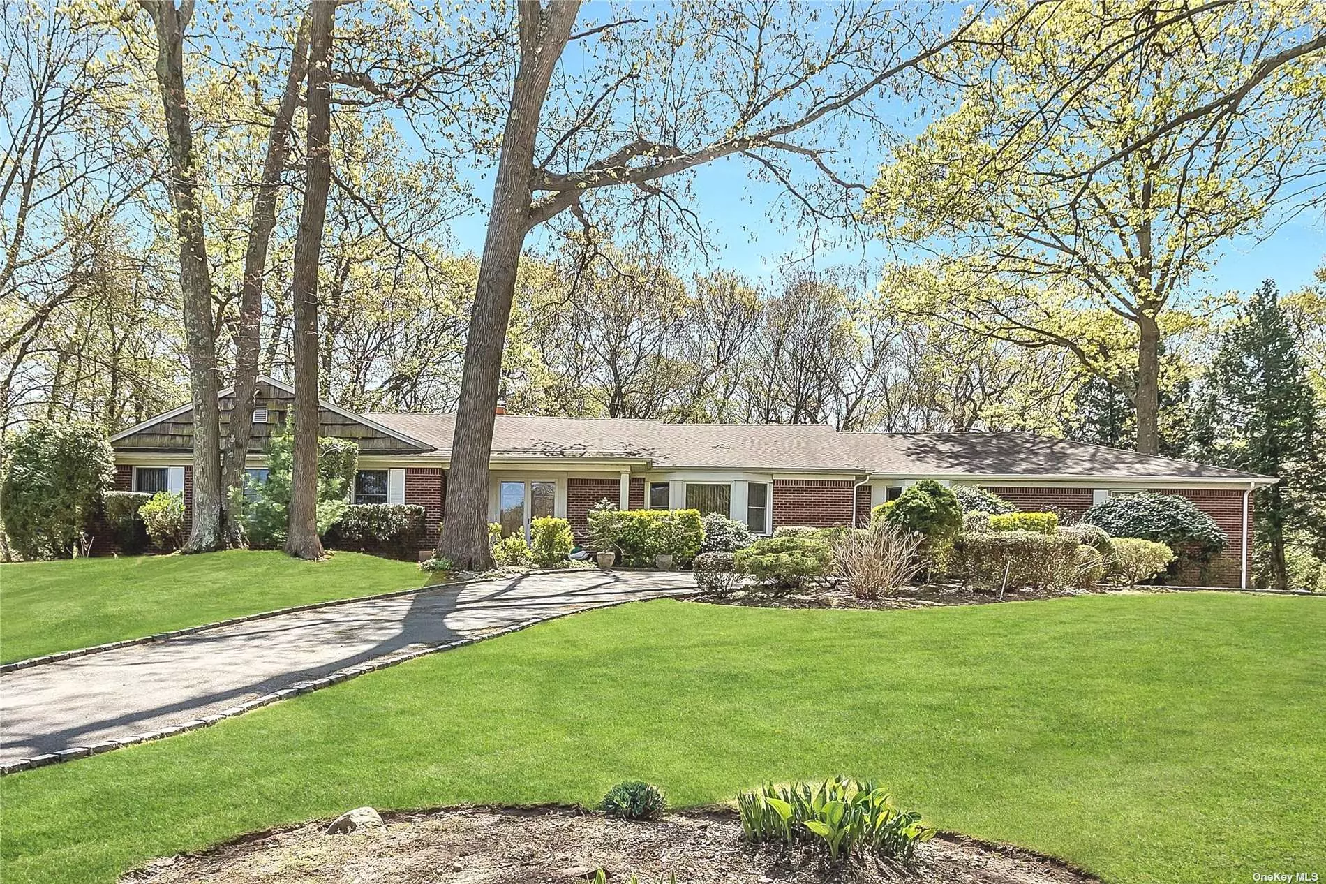 Sprawling Brick Ranch located in North Syosset at the end of a quiet cul-de-sac. Situated on 2 acres of professionally landscaped property complete with Inground Salt Water Pool, Patio and manicured yard. Circular Driveway leads to double door entry with inviting foyer. Spacious Great Room with high ceilings, skylight, fireplace and glass doors to the backyard. Eat in Kitchen with Gas Cooking and glass doors to the backyard lend to effortless entertaining. The bedroom wing is complete with a master suite plus 3 bedrooms and the fifth bedroom is on the other side of the house making it the perfect private guest room. Hardwood Floors, Full finished basement with outside entrance. Gas Cooking, Gas Heat, Central Air. New liner and new sand filter system and pool heater. Located near LIRR, airports, shopping major highways, beaches, country clubs, equestrian centers and fine dining. Syosset Schools, Berry Hill Elementary.