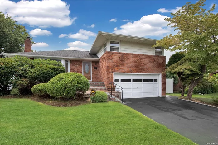 Syosset Groves Updated Split Level Located on a Quiet Street - Offers Living Rm, Dining Rm, NEW kitchen, 3 Bed, 2 Bath. Lower Level Family Rm with Door to Spacious Backyard. Enjoy the Large Trex Deck with Gas BBQ Hook Up. NEW Gas Heat. Syosset Schools. Close to ALL.