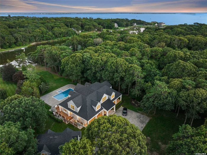 7000 Sq Ft Waterfront Beauty, on 1.85 Private Acres. Like New Construction, Dramatic 2 Story Grand Entrance Foyer. Huge Great Room, Fire Place, Chefs Kitchen, Dining Room, Powder Rm. Beautiful 2nd FL. Family Room w/Fpl. Impressive Primary Suite w/Fpl & Bath, Waterside Terrace. 4 En-Suite Guest Bedrooms, Savant Smart Home System. There is an Additional 2000 Sq.Ft. Finished, High Ceiling, Basement with Professional AMF Bowling Ally, Home Theater & Billiards. 8 Zone HVAC, Laundry Room with Double Washer & Dryer. Beautiful New Gunite Pool & Kiddy Pool with Blue Stone Patios and Wraparound Mahogany Decks, Custom Built in BBQ. Deep Water Boat Dock, 3 Car Garage and Very Large Bonus Room above. Truly Beautiful, A Must See!!!