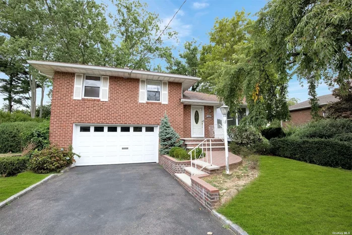 Syosset, Terrific, Spacious Split Level Style Brick Home in the Syosset School District! This 4 Bedroom & 2.5 Bathroom home is well maintained and features a Bright, Open floor Plan! The Main level has an Entry Coat Closet, Formal Living Room & Formal Dining Room with Hardwood floors. The Eat-In Kitchen has Gas Cooking. The 2nd floor features Primary Bedroom Suite w/Full Bathroom, 2 additional generously sized Bedrooms & Full Bathroom. Hardwood floors are also thru-out 2nd floor. The 1st floor level features the 4th Bedroom, Half Bath and 2 Car Garage (Possible Room for Mom). The Lower Level has a Family Room and Large Storage Area with Laundry Area, Utility Area. Lovely Oversized Property, 82&rsquo; x 122&rsquo; with Terrific New Paver Patio. Lots of potential for play area and entertaining, with plenty of room for a Pool! Additional Updates include Heating, Central Air Conditioning, Electric, Gas, Windows, Washer and Dryer, plus more! Robbins Lane Elementary, Southwoods Middle, Syosset High!