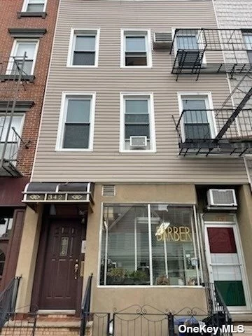 3 Family Mixed Use home located in the heart of Williamsburg only 2 blocks to the L train. Featuring 3 Residential units and 1 commercial unit. The 1st floor Front portion of this home is used as a Barber shop. 1st Fl rear apt is a 3 room, 1 bedroom with access to a small yard. VACANT - tenant was paying $1800. 2nd Fl apt. is a 4 room, 2 bedroom apt with a large EIK, 2 bedrooms, a new bathroom and 4 large closets. Tenant pays $3050 per month and has no lease. 3rd Fl is 6 room, 3-bedroom apt. Tenant pays $3200 and has no lease. Also featuring a large full basement with separate storage rooms and a small yard. Great Williamsburg Location.